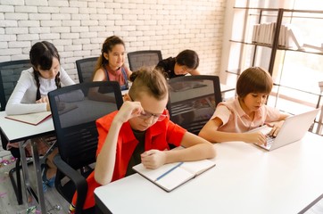 a group of elementary school children who are always in the classroom.