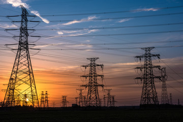 Silhouette of Power Supply Facilities at Sunset