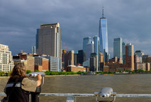 Man Looking Through Binoculars In New York City Manhattan