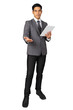 © I Believe I Can Fly - Happy young businessman standing hold tablet in suit on white background, isolated concept