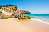 Fototapeta Sawanna - Rocks on sandy Praia do Amado beach, Portugal