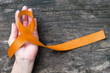 Amber color ribbon for raising awareness campaign on appendix cancer illness
