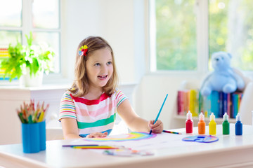 Wall Mural - Kids paint. Child painting. Little girl drawing.