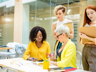 Wall Mural - attractive women preparing a report. close up photo