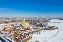 Peter And Paul Cathedral In Saint Petersburg, Russia. It Is One Of The Main Landmarks Of The City. Golden Tall Spire Of Peter And Paul Cathedral On The Blue Sky Background In Winter