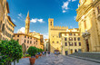 Piazza di San Firenze square with Chiesa San Filippo Neri, Badia Fiorentina Monastero catholic church and Bargello museum in historical centre of Florence city, blue sky white clouds, Tuscany, Italy