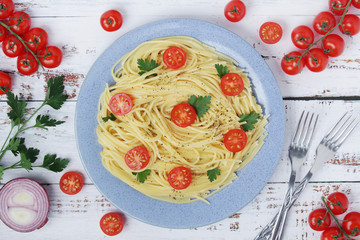 A plate with spaghetti with tomatoes