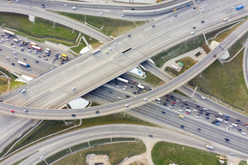 Wall Mural - Aerial view of road junction in Moscow from above, automobile traffic and jam of many cars, road junction on the Moscow Ring Road and the M11 toll road.