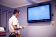 © Aleksej - A man worker fix tv with blue screen 'no signal'