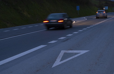 give way, cars running on the road at night