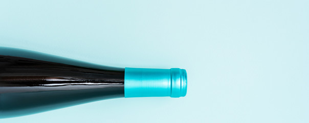 Wall Mural - Colorful bottle caps of white and rose wine bottles on turquoise background. Minimal abstract colorful layout concept of summer time alcohol beverage. Long wide banner.