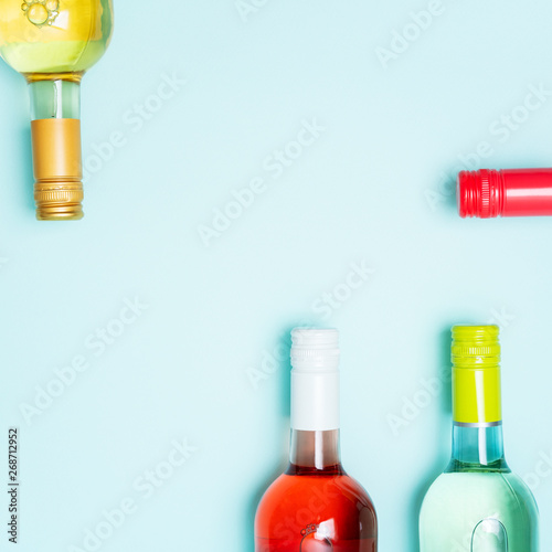 Download Screw Bottle Foil Caps In Different Bright Colors Of White And Rose Wine Bottles On Blue Background With Copy Space Minimal Abstract Colorful Mockup Concept Of Alcohol Beverage Flat Lay Stock Photo