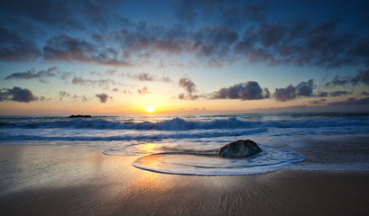 waves breaking against rock near garrapata state park california