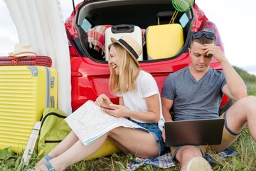 Wall Mural - Remote work on the laptop of a young couple on vacation