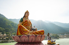 Stunning View Of The Statue Of Sitting Goddess Parvati And The Statue Of Lord Shiva On The Riverbank Of The Ganges River. Rishikesh, Uttarakhand, India