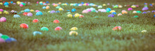 Lots Of Colorful Easter Eggs Scattered In Green Grassy Field