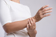 © Siam - Closeup woman holds her wrist hand injury, feeling pain. Health care and medical conept.