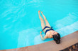 © Nichapa - Carefree woman relaxation in swimming pool summer Holiday concept