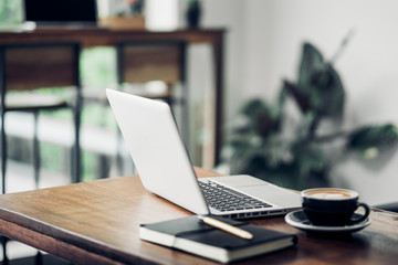 Poster - laptop on table with coffee cup in cafe