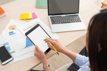 Poster - top view woman use tablet and laptop working online on table at home.mock up template device screen.Digital lifestyle concept.clipping path screen.