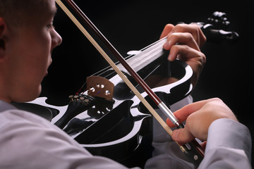 Wall Mural - Young men playing the violin