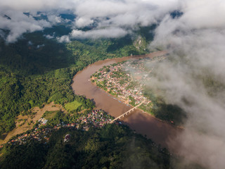 Nong Khiaw panoramic view over Nam Ou River valley Laos national flag scenic mountain landscape famous travel destination in South East Asia