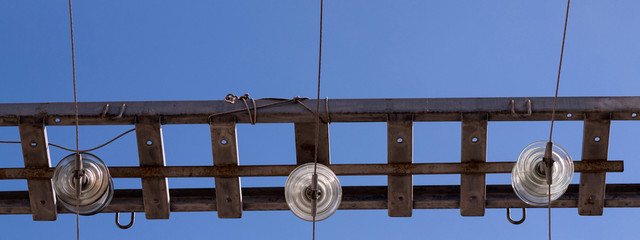 Polymer ceramic insulator with high voltage. Dangerous engineering facility. Close up.