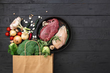 Grocery Bag With Healthy Food On A Wooden Background Top View