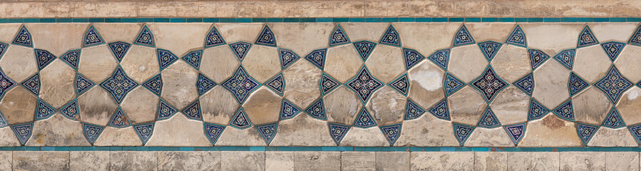 Poster - ancient wall of a mosque of mosaic tiles