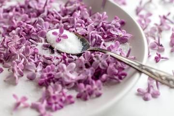 Homemade preparing of lilac sugar with amazing fragrance