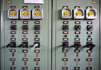 Wall Mural - At the control operations room. Clouse up of a main control board: tumblers, manometers, buttons