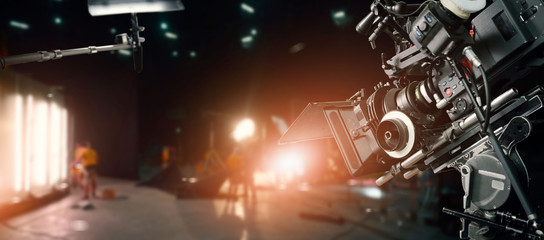 Poster - Behind the scenes of making of movie and TV commercial. Camera of movie and video production. Film Crew. B-roll, with crew team in studio and set on dark background.