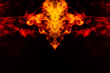 Smoke Of Different Orange And Red Colors In The Form Of Horror In The Shape Of The Head, Face And Eye With Wings On A Black Isolated Background. Soul And Ghost In Mystical Symbol