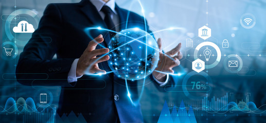 Poster - Businessman holding global data network and analyzing sales data and economic growth. Technology and business strategy. Digital marketing on interface hologram screen.