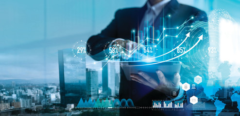 Fototapete - Digital marketing. Business strategy. Businessman using tablet analyzing sales data and economic growth graph chart on hologram screen. Business strategy and digital data.