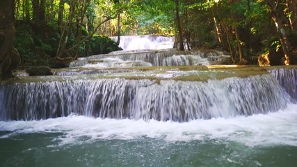 Wall Mural - Waterfall flow standing with forest enviroment low angle view in thailand called Huay or Huai mae khamin in Kanchanaburi Provience, Thailand., Zoom out.