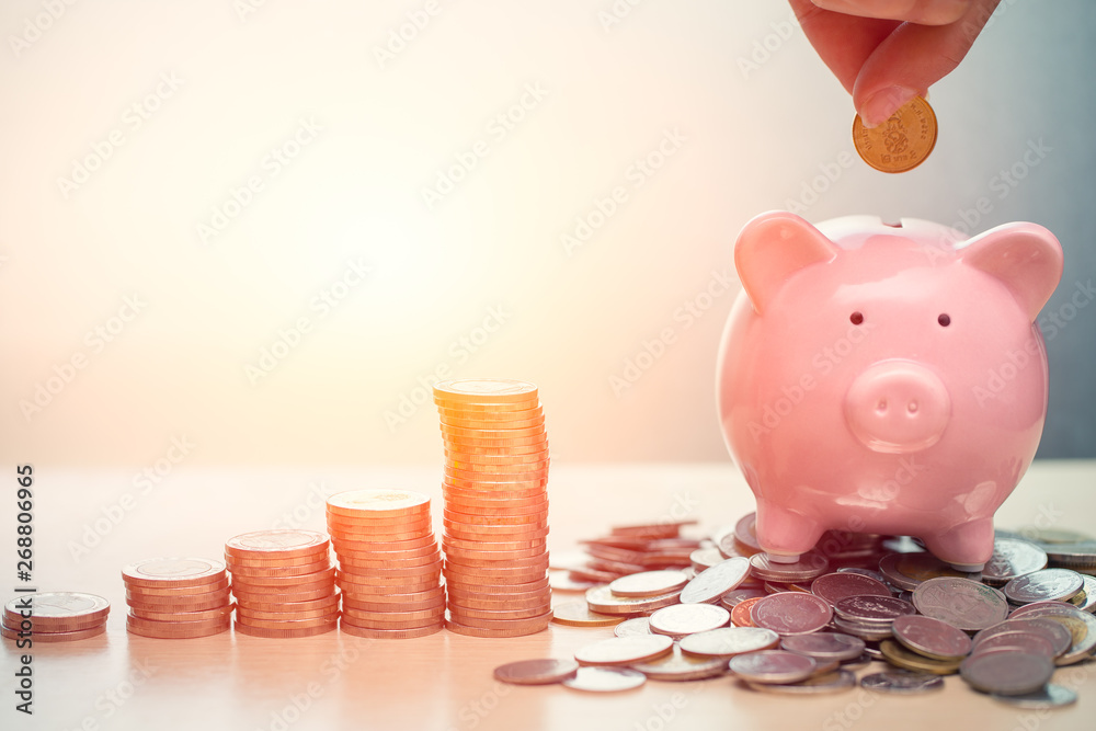 Hand Saving Money concept, Piggy bank with coin for Wealth Income and Profit Financial Business Grow