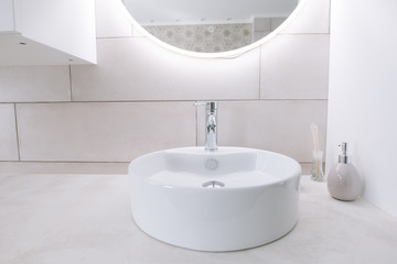 Minimalist bathroom with sink and mirror. Mirror with led backlight