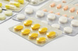 © worldofstock - Group of multi colored pills, capsule on white background