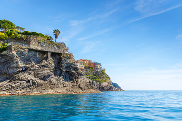 Manarola, Liguria, Italy fisherman village, colorful houses on sunny warm day. Monterosso al Mare, Vernazza, Corniglia, Manarola and Riomaggiore, Cinque Terre National Park UNESCO World Heritage