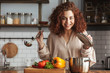 © Drobot Dean - Photo of adorable caucasian woman holding cooking ladle spoon while eating soup at home