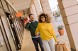 © BGStock72 - Beautiful young multiethnic couple enjoying in shopping, having fun in the city