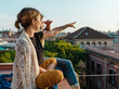 © Milles Studio/Stocksy - Relaxing man and woman sitting on terrace