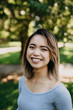 © Leah Flores/Stocksy - Portrait of Beautiful Asian Woman in Park