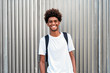 © Santi Nunez/Stocksy - Portrait of handsome afro man looking at camera