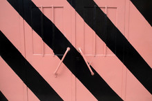 Garage Door With Pink And Black Stripes Background