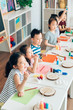 © MaaHoo Studio/Stocksy - Preschool kids painting in classroom