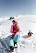 © Marco Govel/Stocksy - Snowboarder woman
