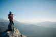 © AD Photography/Stocksy - woman hiker enjoying cup of tea from the top of the mountain