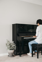 Guy Playing The Piano At Home